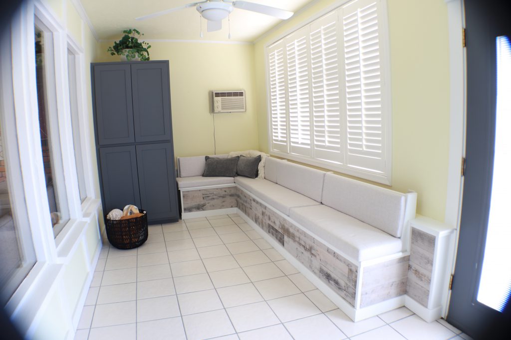 A large cabinet and long storage bench in a cozy Arizona room.