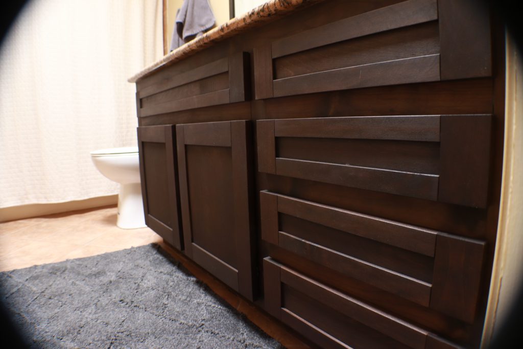 Ebony-like Shaker style doors and drawer fronts give a new look to an old bathroom vanity.