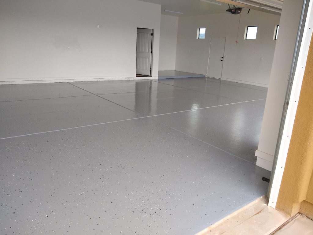 A large garage floor with an easy to clean epoxy finish.