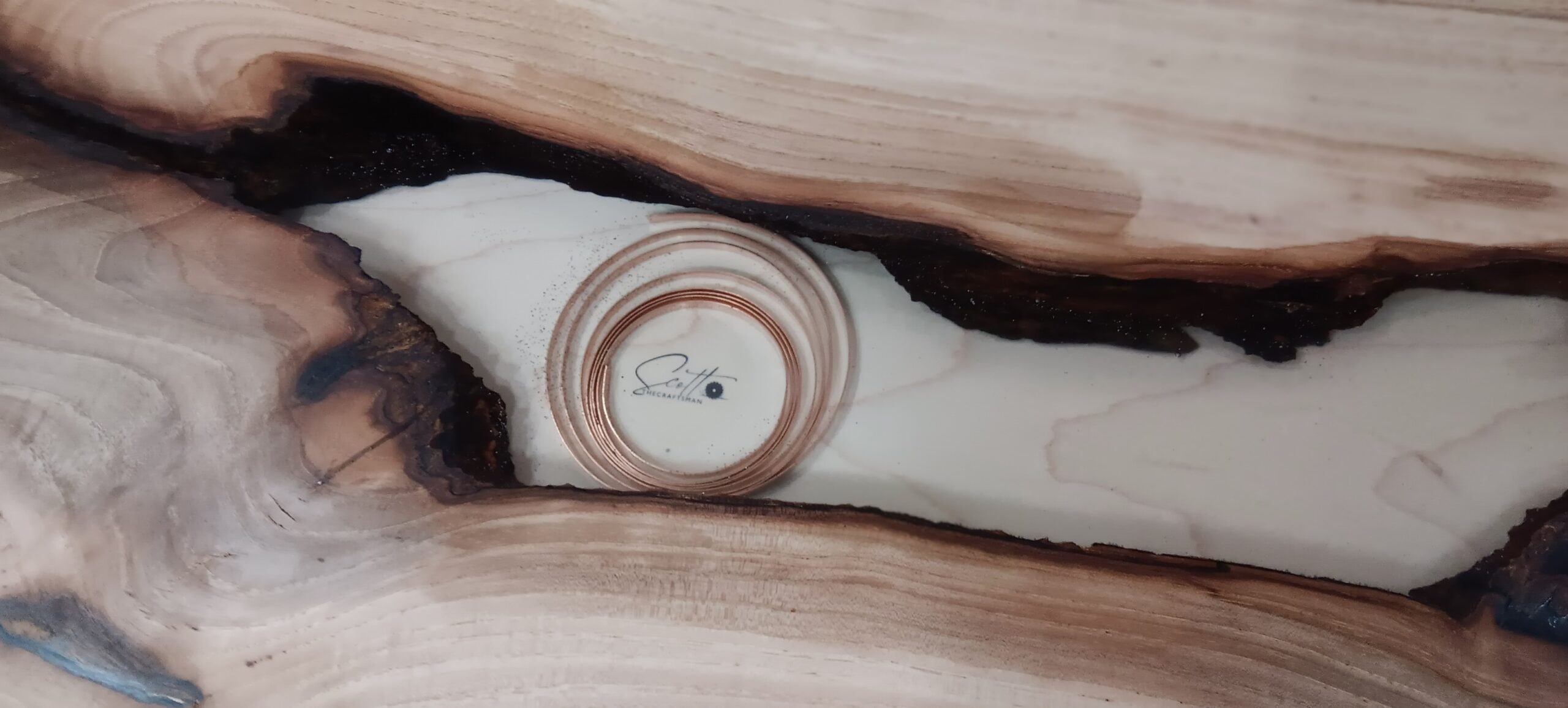 The ScottTheCraftsman logo is tastefully incorporated into this tabletop void, along with some copper that pays homage to Arizona.